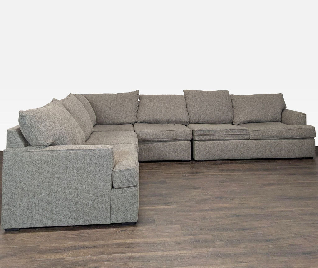 Large light gray sectional sofa from Living Spaces with soft cushions and modern, clean design in great condition.
