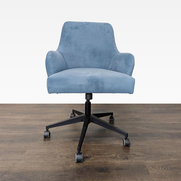 Skyline Furniture chair with soft blue fabric, armrests, and black base with casters for easy movement.