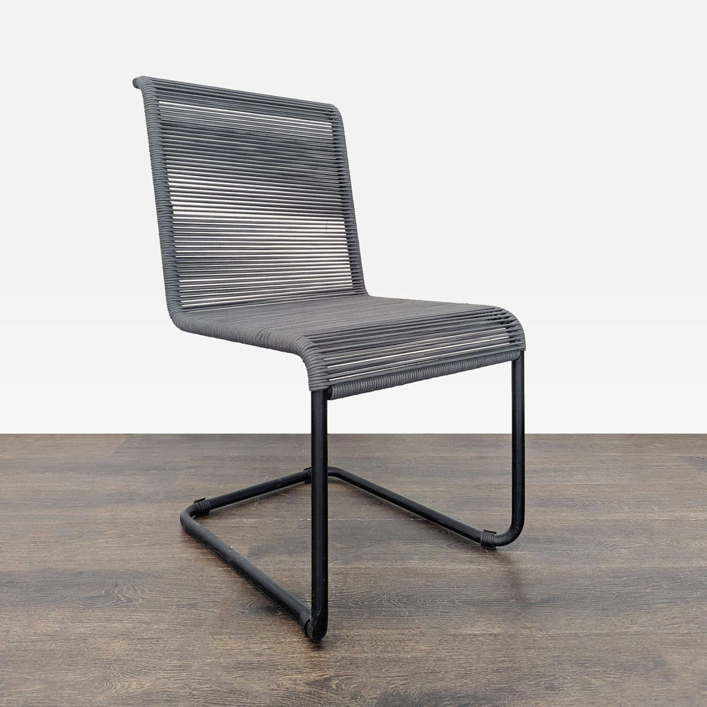 Sleek chair featuring a black frame and woven design, ideal for various rooms, easy to clean and comfortable.