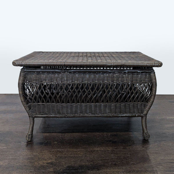 Rectangular all-weather wicker coffee table with a dark brown finish and curved legs, suitable for indoor or outdoor use.