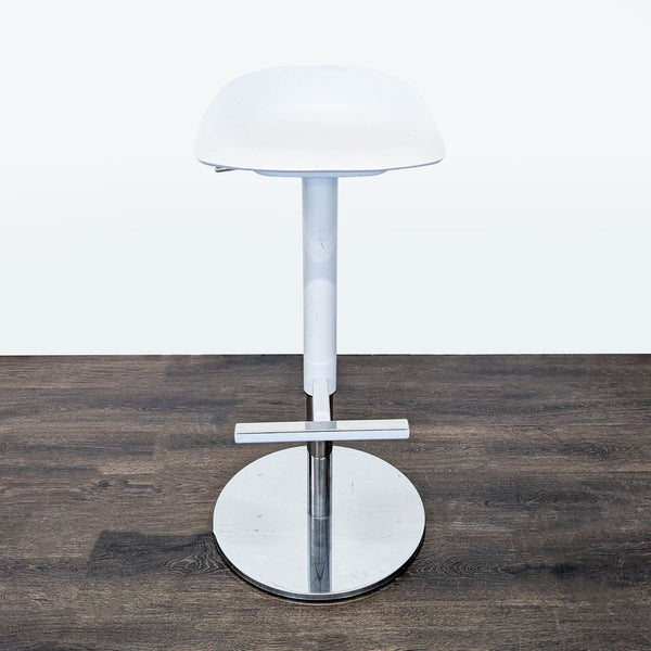 1. Modern white Ikea stool with a scooped seat, height adjustment, metal footrest, and sturdy circular base.
