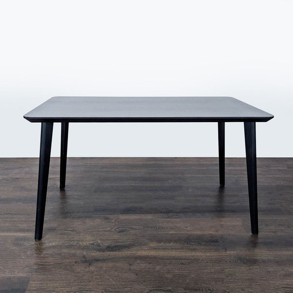 Ikea LISABO dining table with accordion-shaped fibreboard top and solid wood legs, designed by K and M Hagberg.