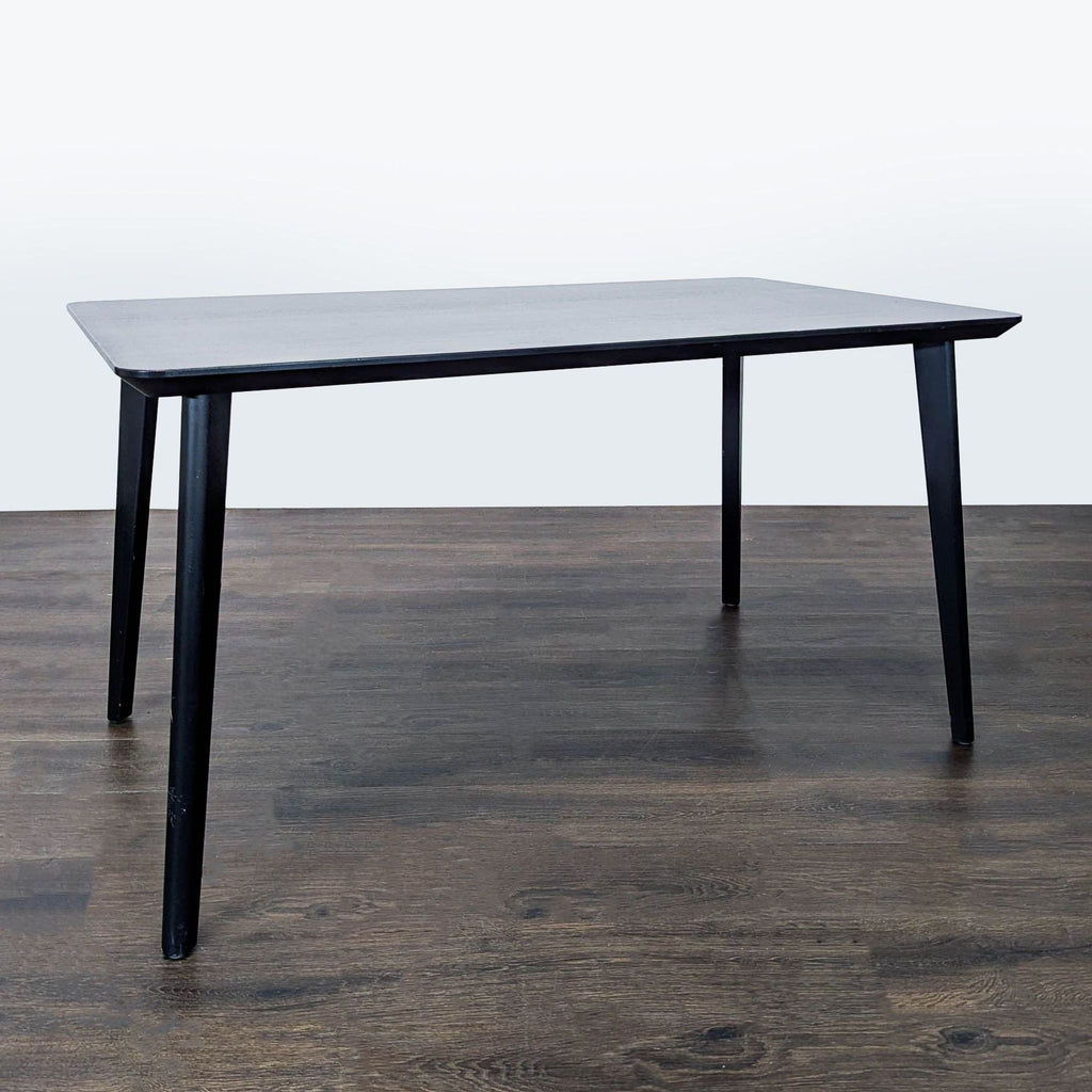 Modern Ikea dining table, lightweight with unique accordion-patterned top and sturdy solid wood legs.