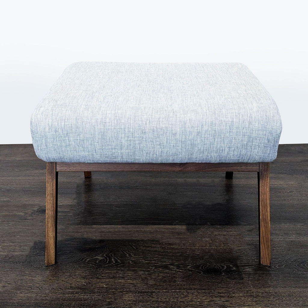 Article brand bench boasting an ergonomic design and sleek black walnut frame, ideal for any space.