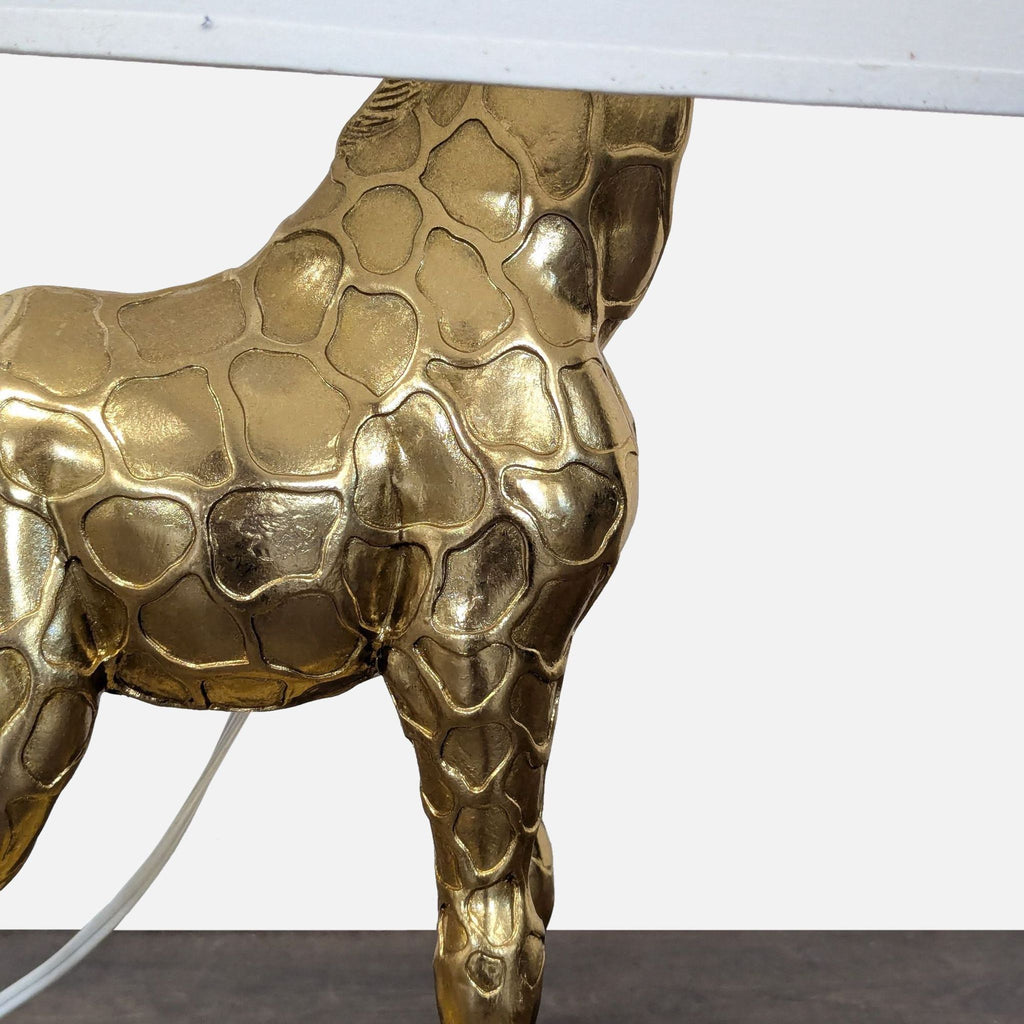 Elegant lamp with metallic giraffe base and white shade, adds playful charm to any lighting setup.