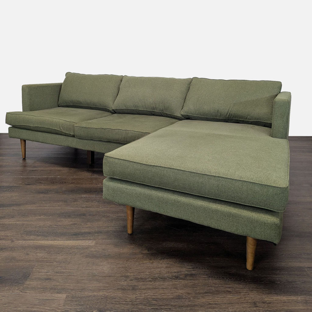 Sleek Joybird sectional sofa in green fabric, featuring a right chaise and comfortable, supportive cushions.