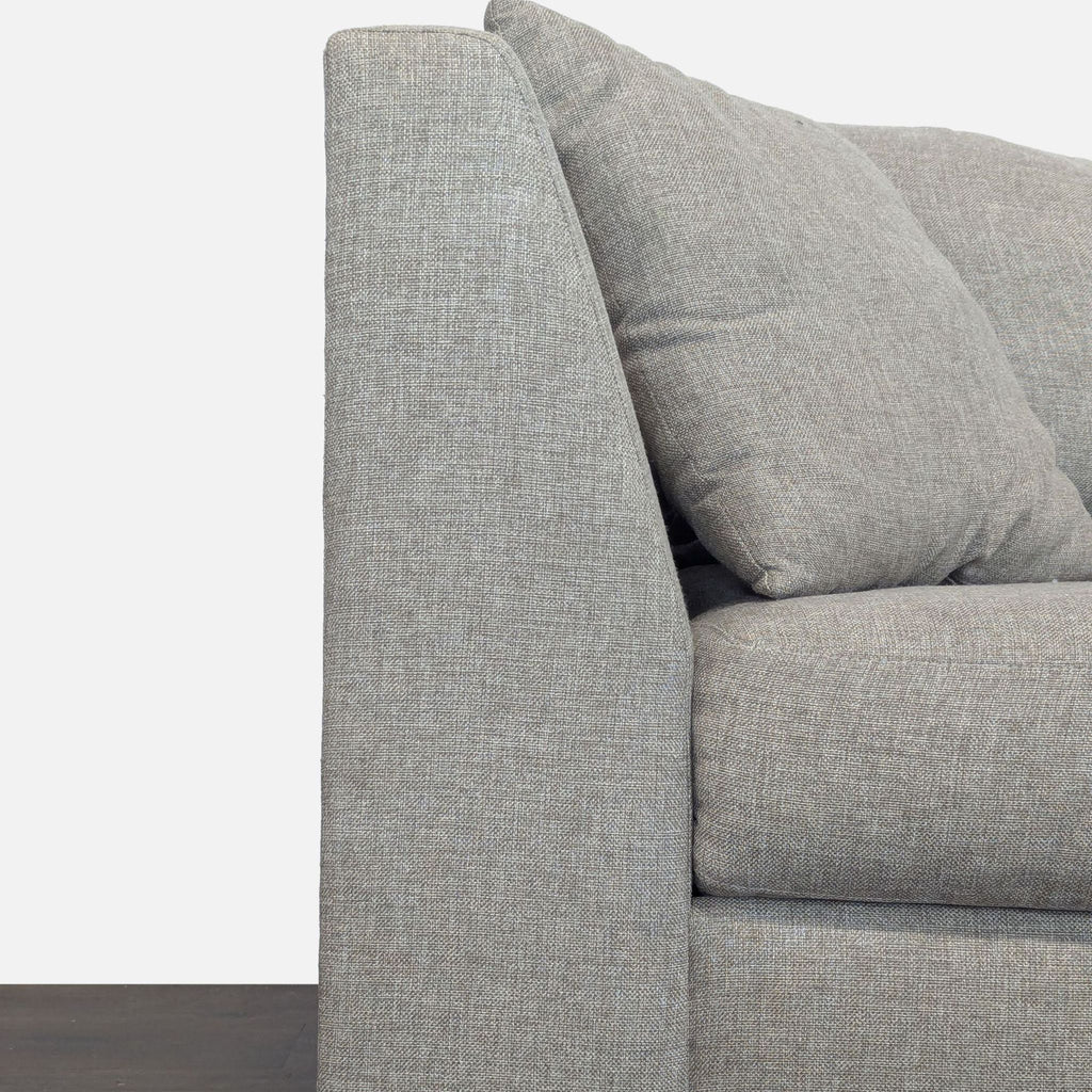 Modern sectional with deep seating, supportive armrests, and soft fabric in a stylish L-shape for comfort.