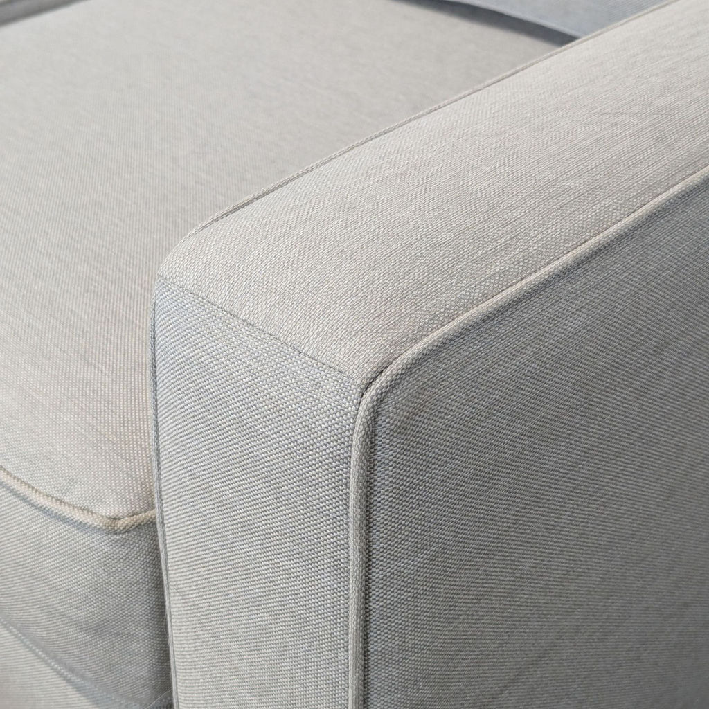 Modern L-shape Pottery Barn sectional featuring clean lines and supportive cushions in a neutral hue.