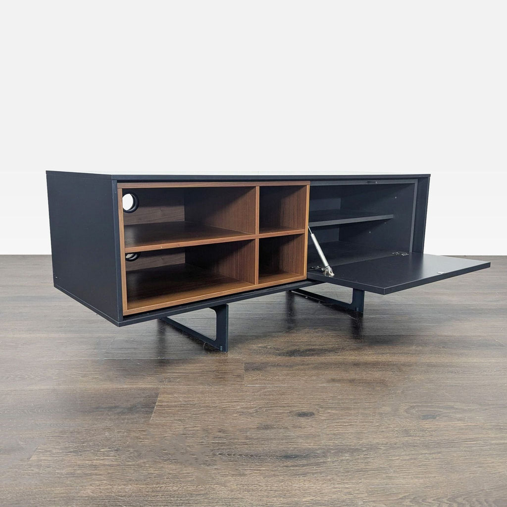 Modern Spanish entertainment center by Design Within Reach featuring steel legs, wood and lacquer, and ample storage.