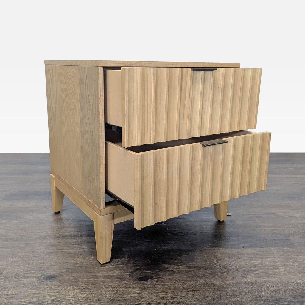 Wood end table featuring scalloped drawer fronts and ample display space, designed by Shea McGee.  