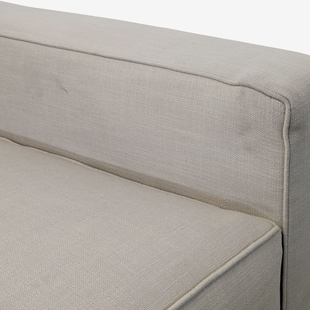 Comfortable beige 3-seat sofa with clean lines, square armrests, and supportive tufted backrest for versatile spaces.