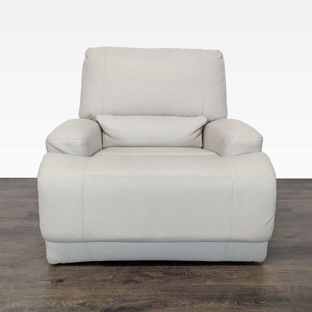Ikea lounge chair in beige leather with wide armrests and recliner function, perfect for living rooms.