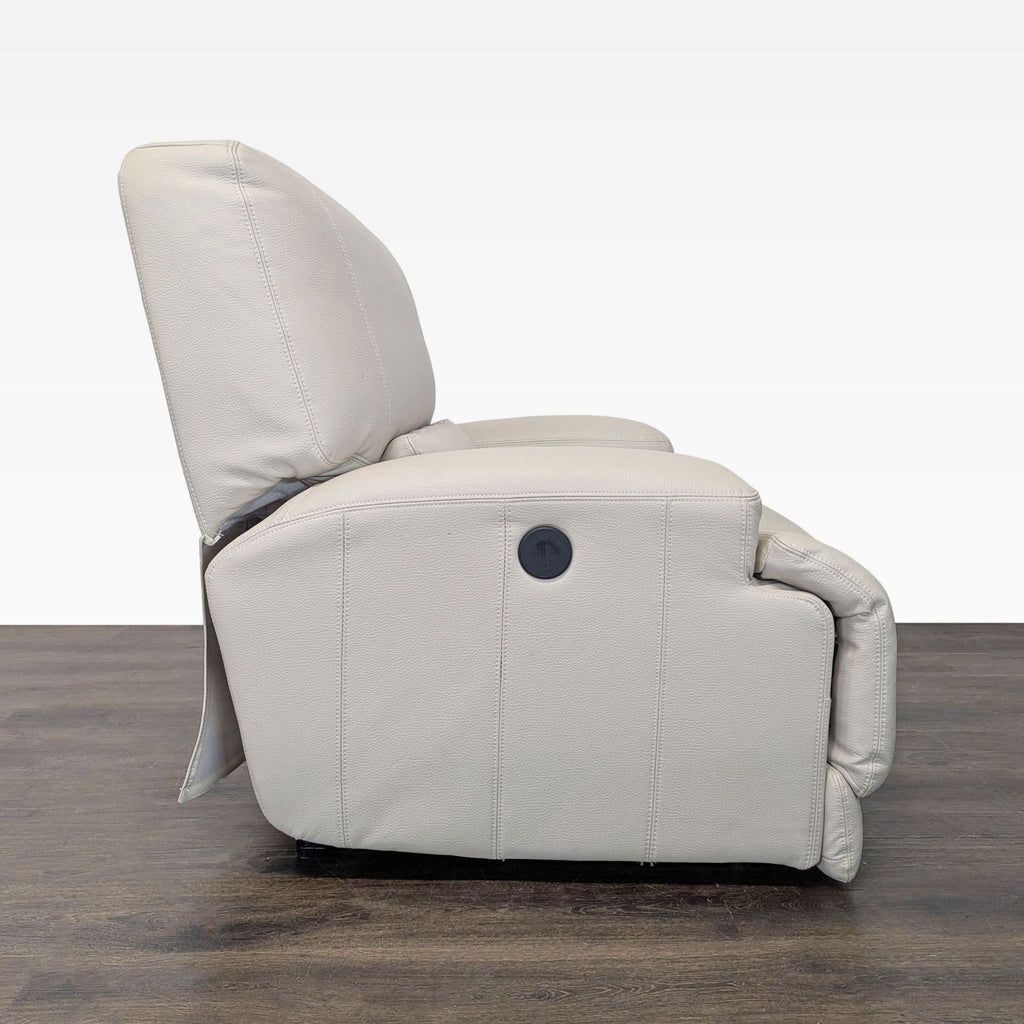 Beige leather Ikea lounge chair featuring plush cushions and modern design, suitable for relaxing at home.
