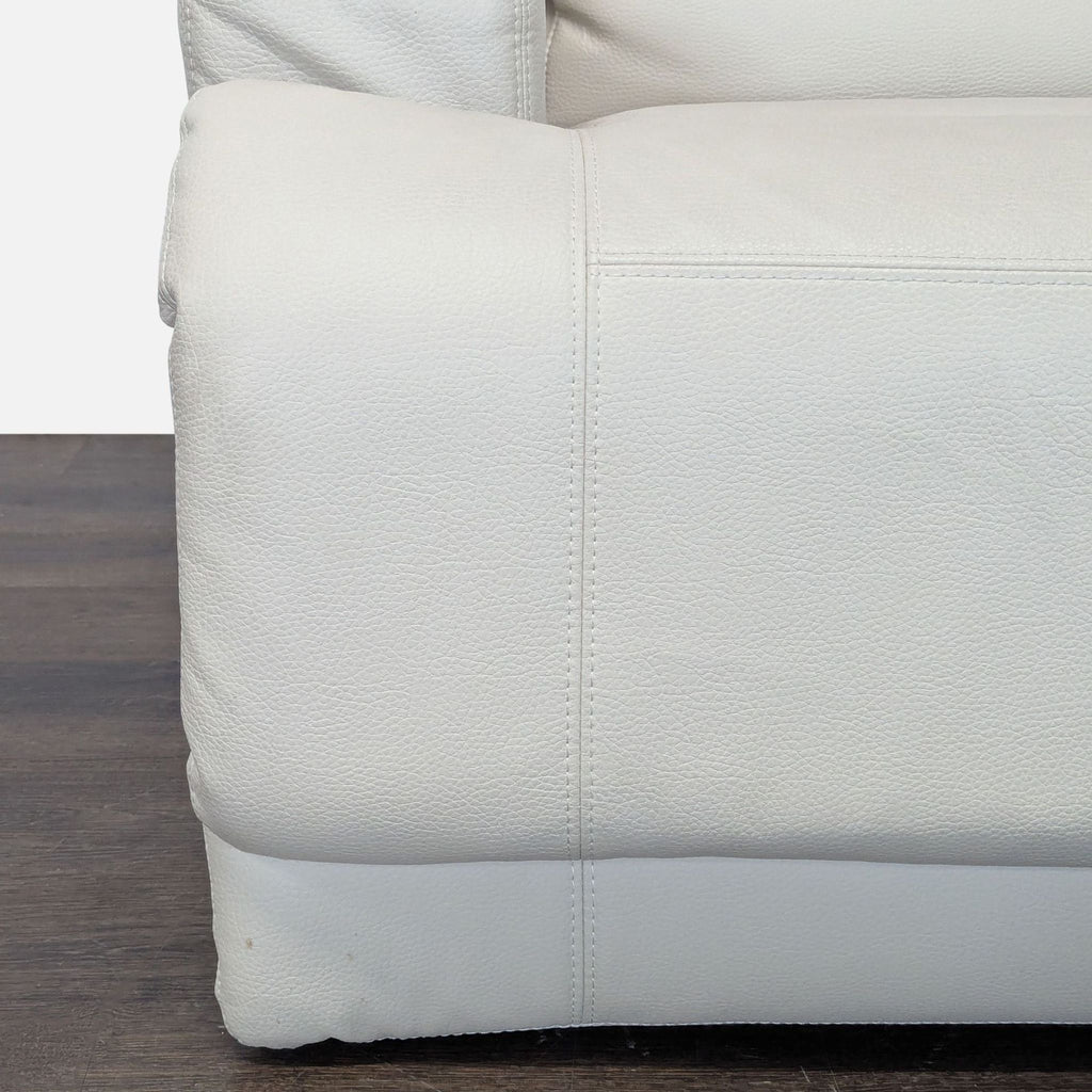 Comfortable Ikea lounge chair with soft leather, cushioning, and recliner function; suits modern or classic decor.