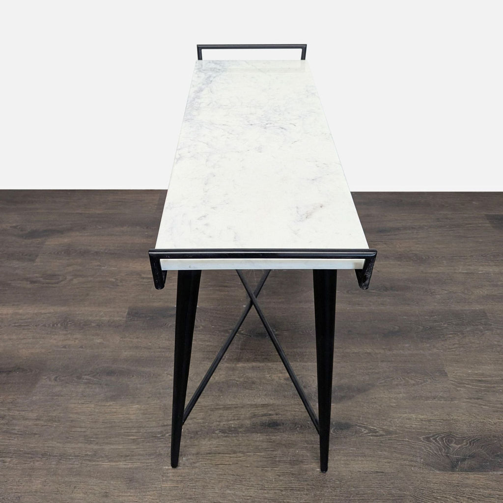 3. Narrow marble console table by Threshold With Studio McGee, black handles, and crisscross metal support.