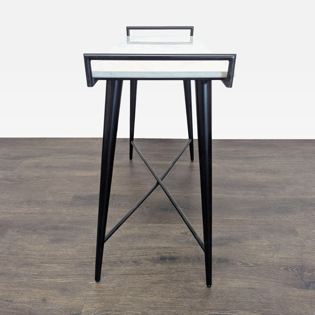2. Modern side table with a marble surface, black metal X-base, and sleek side handles, front view.