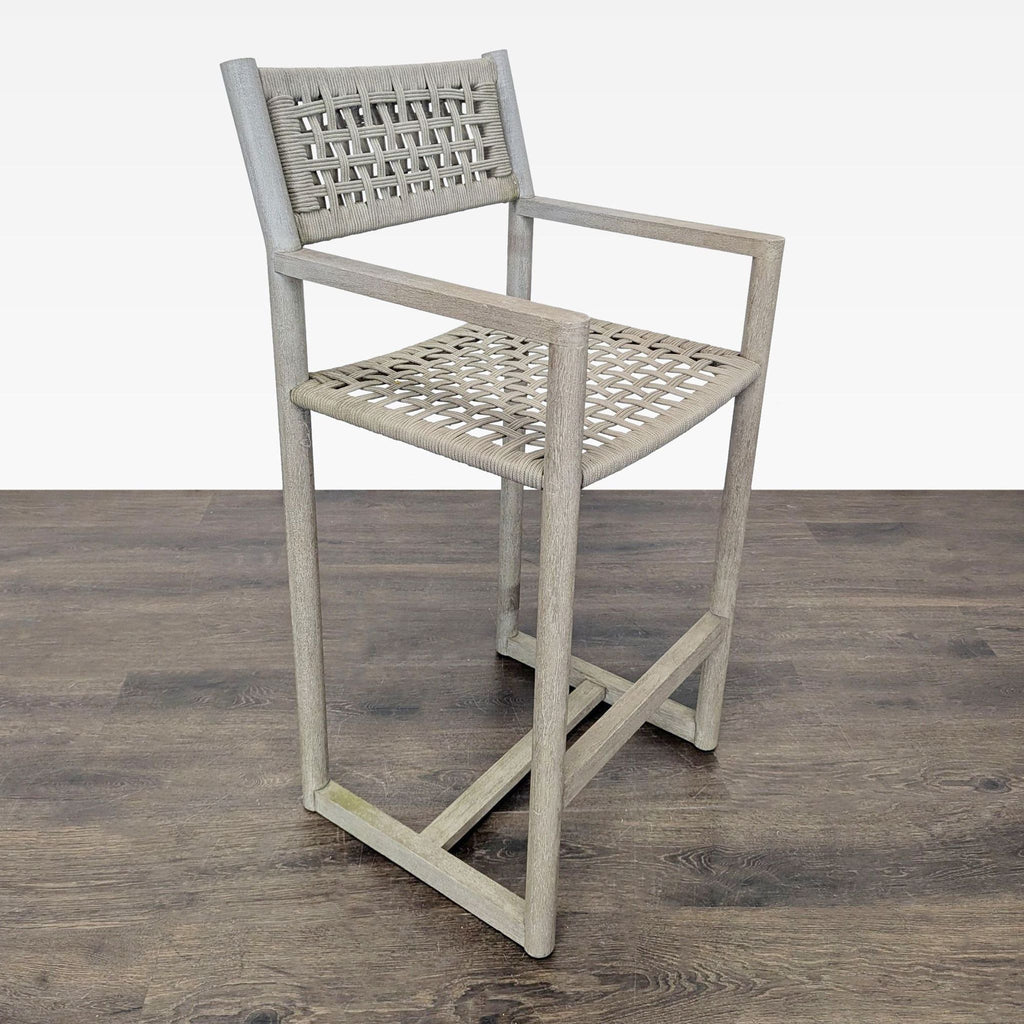 Modern bar chair with woven back and seat on a teak frame, ideal for kitchens or high tables.