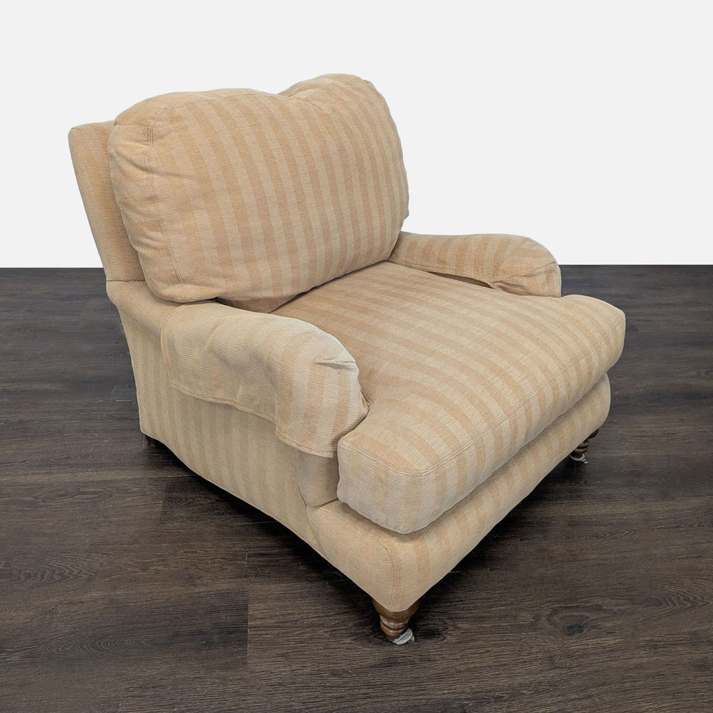 Plush lounge chair in soft beige stripes, featuring rolled arms and wooden legs, perfect for stylish relaxation.
