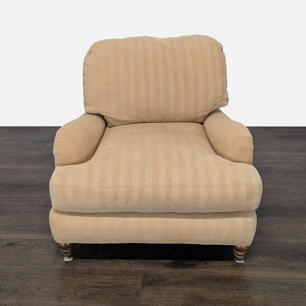 Crate & Barrel lounge chair with beige striped fabric, rolled arms, and turned wooden legs for a classic look.