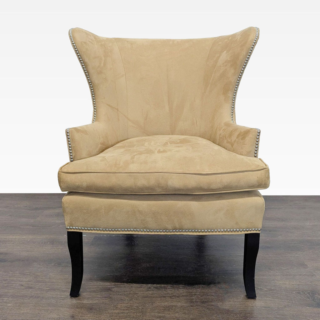 Williams Sonoma Home tan lounge chair with silver nailhead trim and dark wood legs, ideal for living rooms.  
