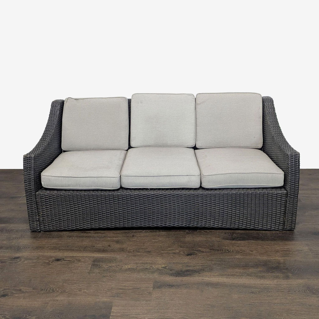 Dark brown wicker outdoor sofa with three plush cushions, perfect for patios, by Threshold, seats up to three.