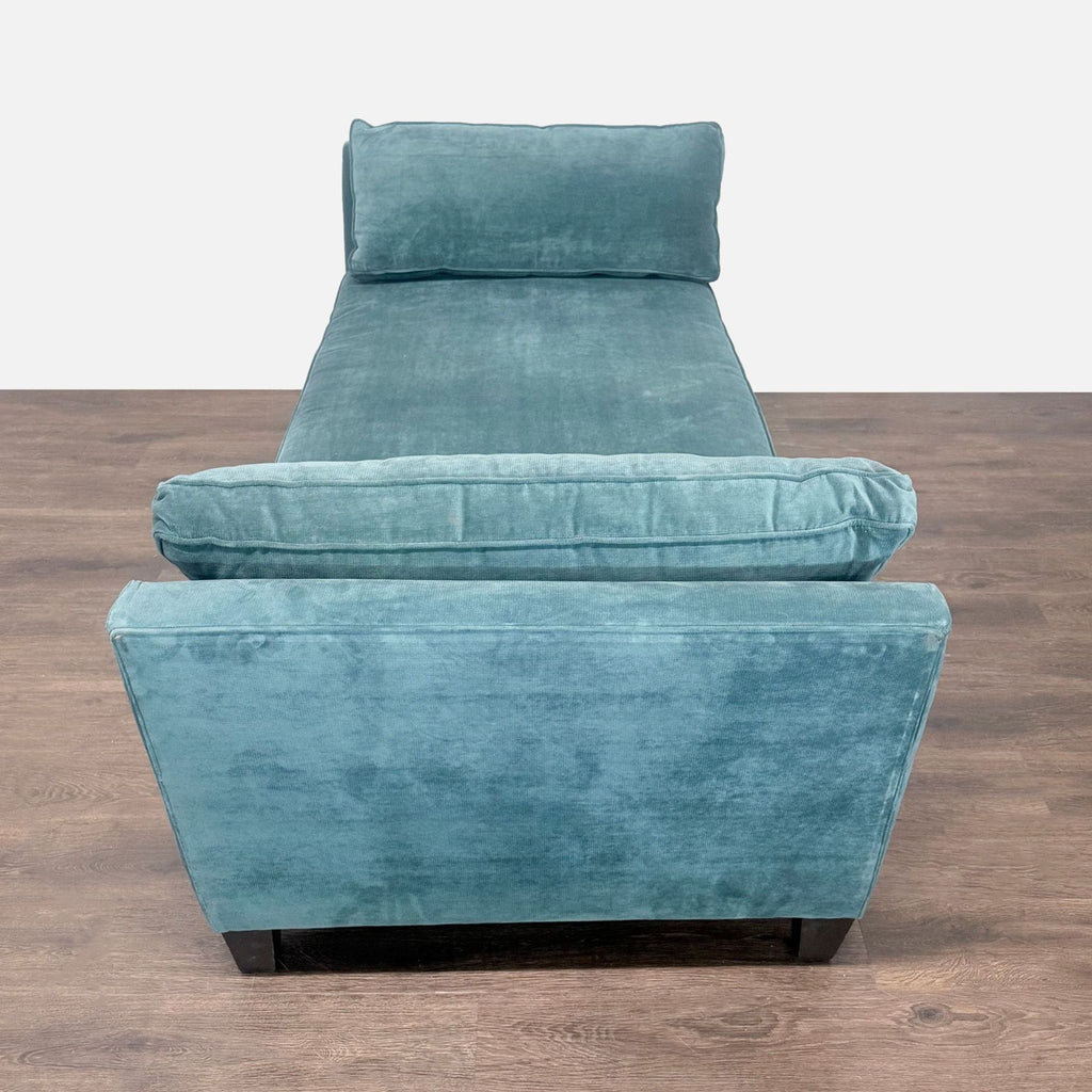 Gently used blue velvet chaise from Living Spaces with comfortable seating, sturdy legs, and stylish appeal.
