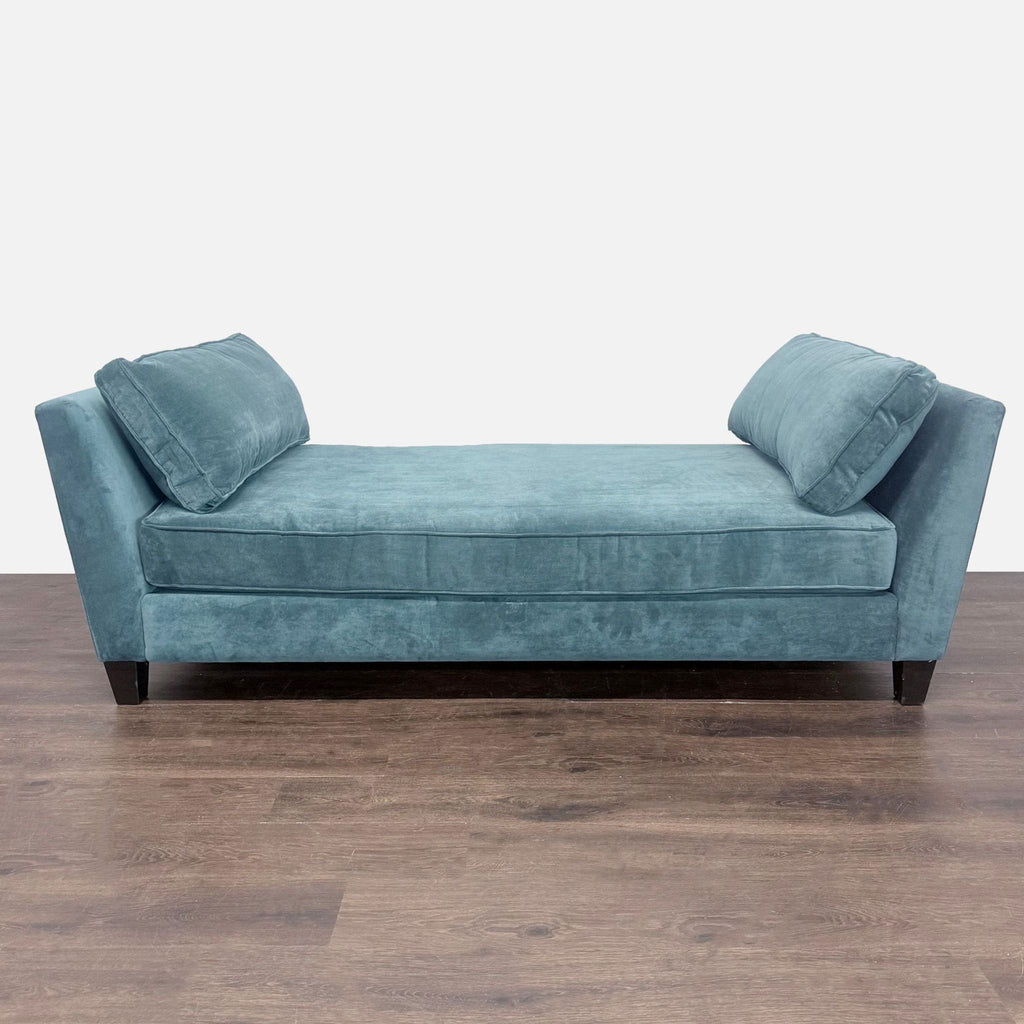 Blue velvet Living Spaces chaise sofa with modern lines, spacious seat, and sturdy legs, gently used.
