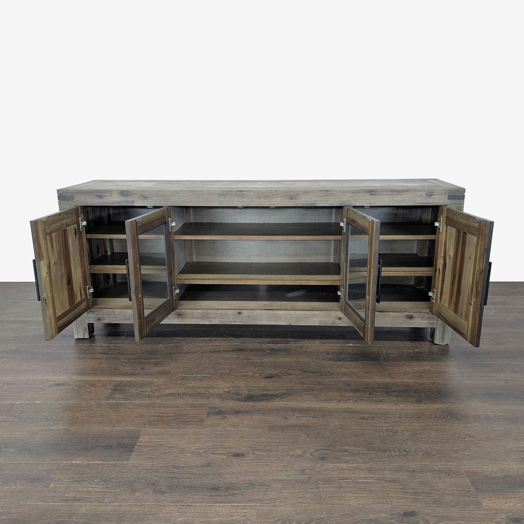 Macy’s entertainment center in sturdy wood, featuring glass door panels and ample interior shelving for media.