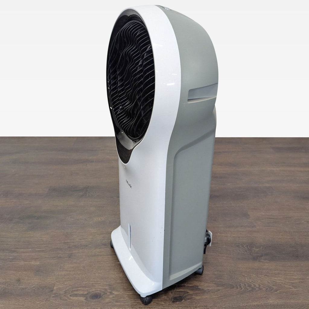 Newair portable air cooler with smooth-rolling wheels, user-friendly controls, and water indicator.