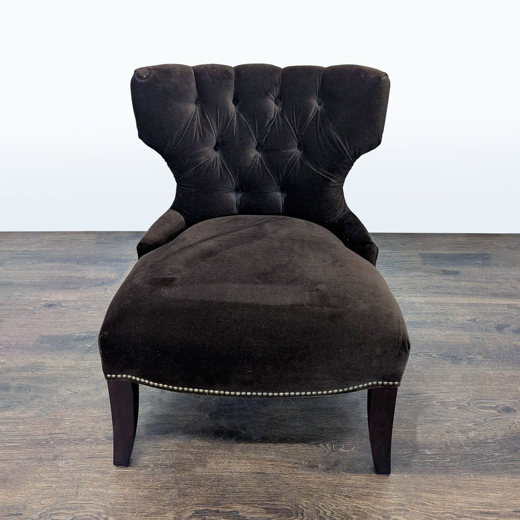 Classic Pottery Barn lounge chair, featuring a velvet tufted back, nailhead trim, and solid wood legs.