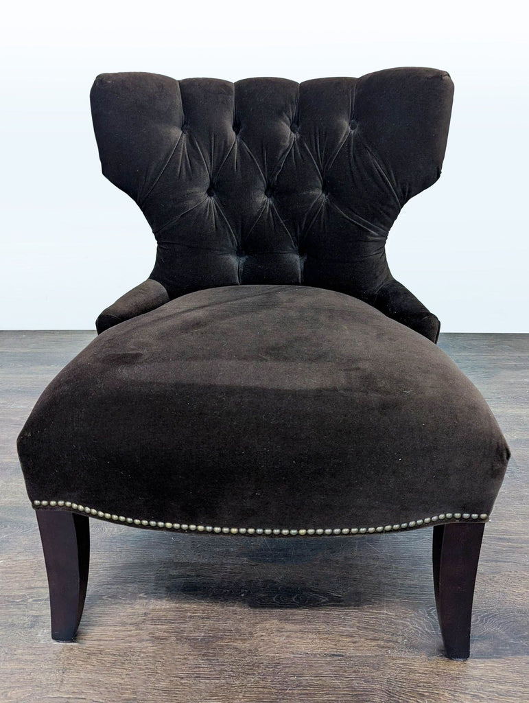 Pottery Barn lounge chair in soft brown velvet with tufted back and nailhead-trimmed dark wood legs.