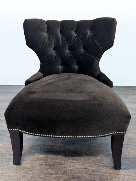 Pottery Barn lounge chair in soft brown velvet with tufted back and nailhead-trimmed dark wood legs.
