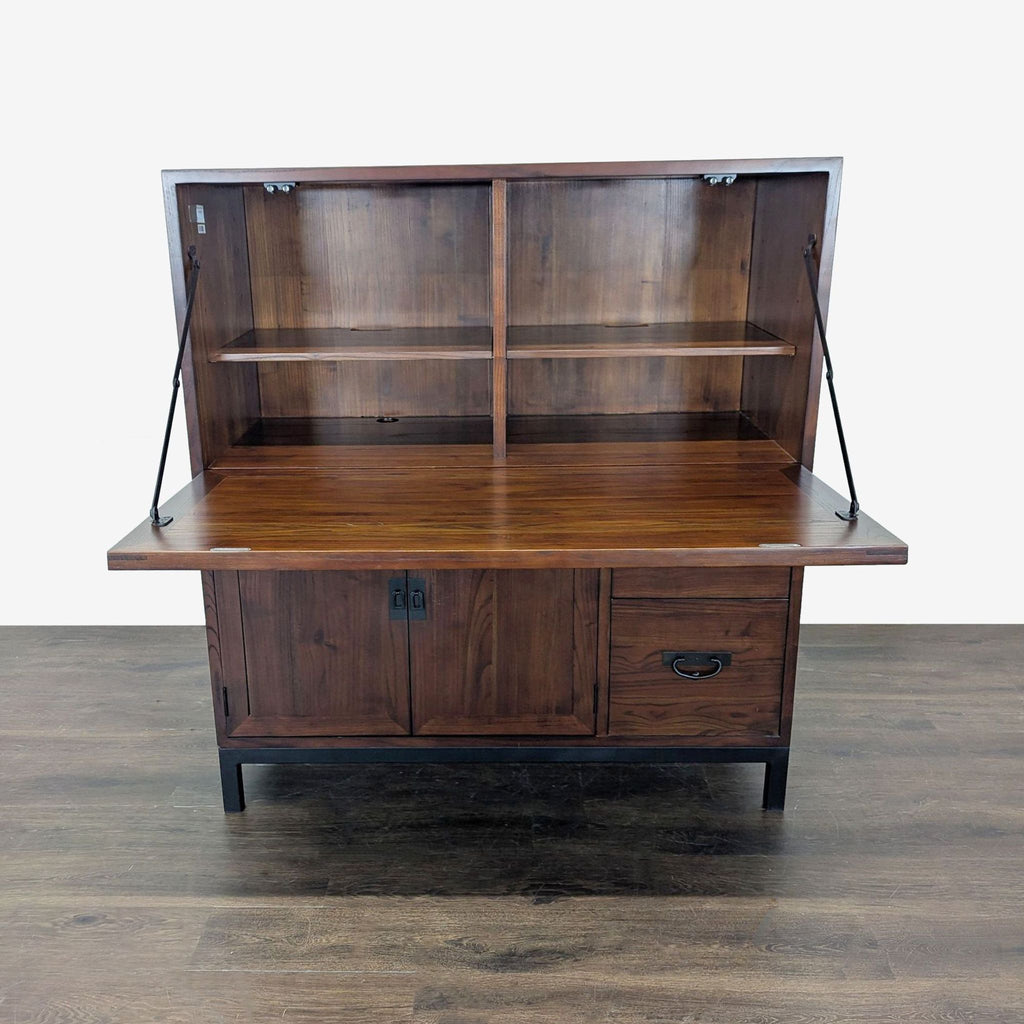 2. Compact wood desk by Room & Board Maria Yee featuring fold-down workspace, shelving, and lower storage drawers.  