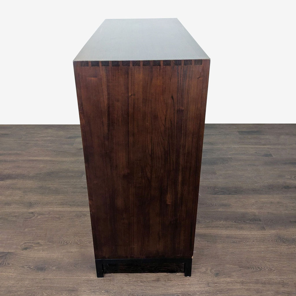 3. Sleek Maria Yee desk in rich wood; top folds open, revealing shelves, two drawers, and a cabinet for storage.