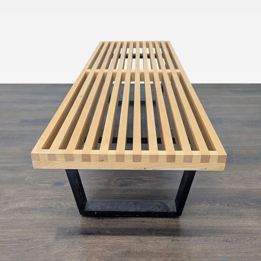 Herman Miller maple platform bench with clean lines and ebonized legs, first introduced in 1946 by George Nelson.