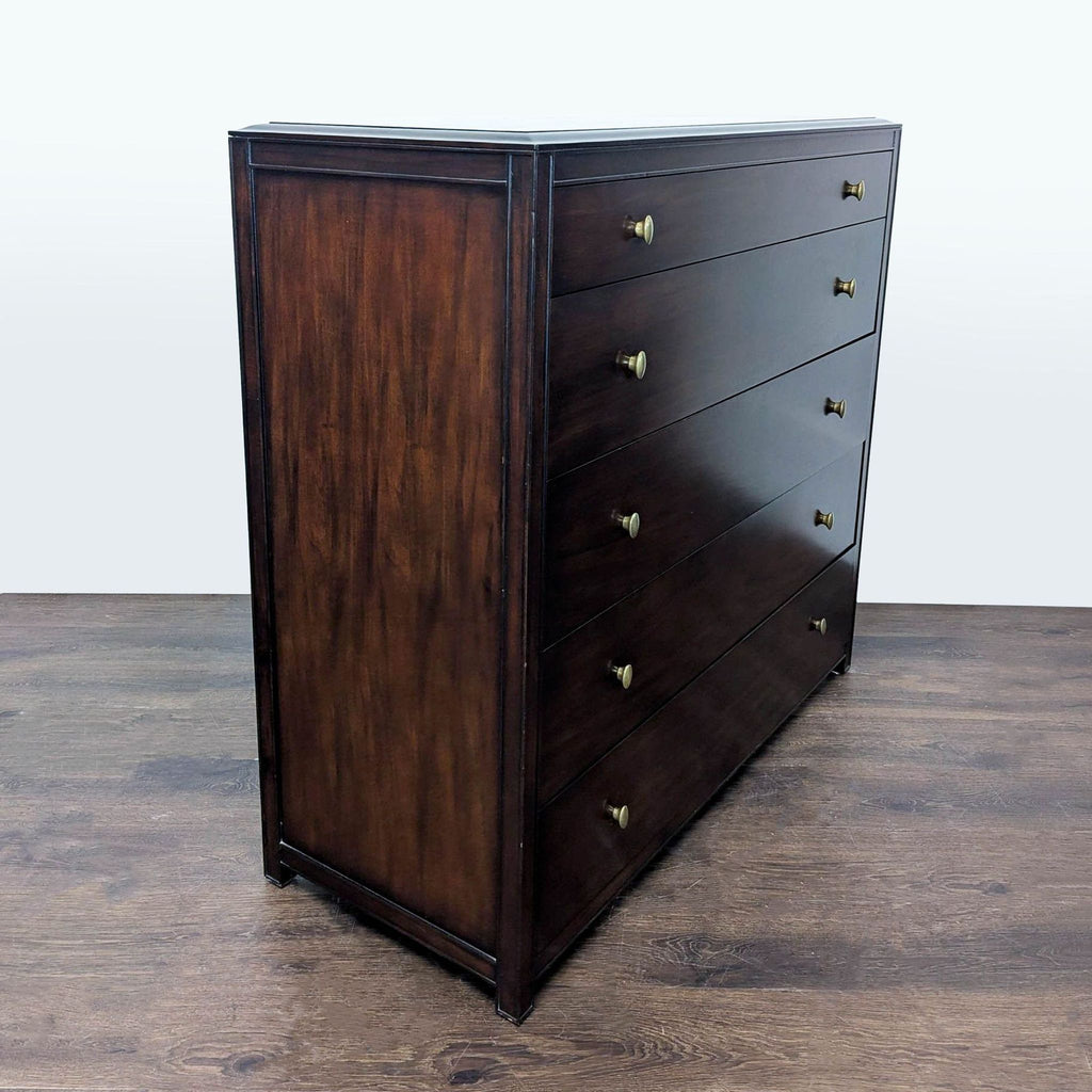Modern dresser by Restoration Hardware, features five roomy drawers, brass knobs, and timeless design.