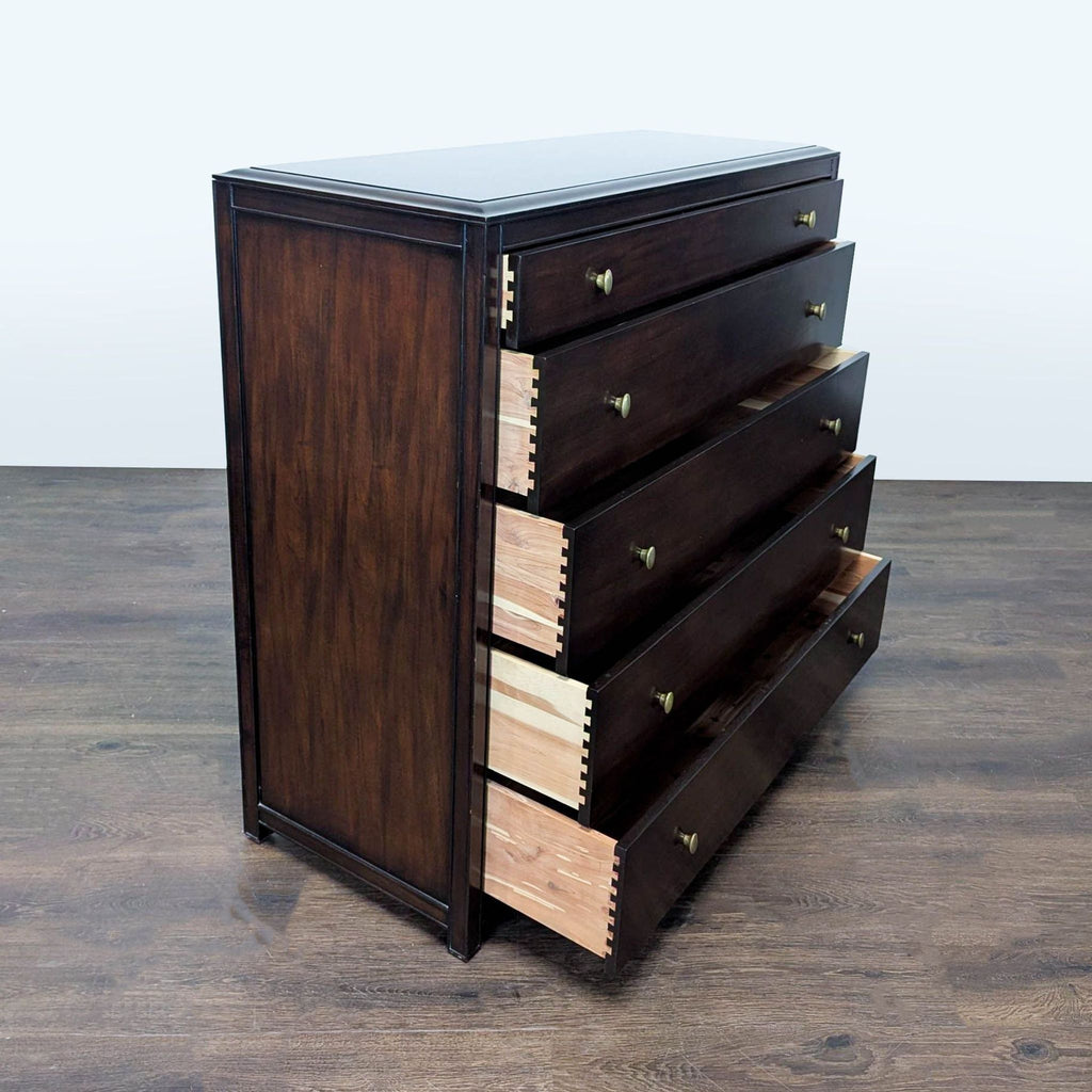 Sleek dark wood dresser with five spacious drawers, brass accents, and sturdy build from Restoration Hardware.