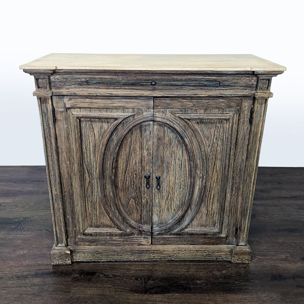 Rustic wooden cabinet with oval-patterned front doors and a spacious top tray surface for extra storage.
