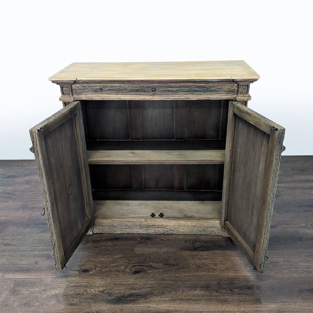 Small cabinet with rustic finish, unique oval door accents, and an additional top tray area for versatility.