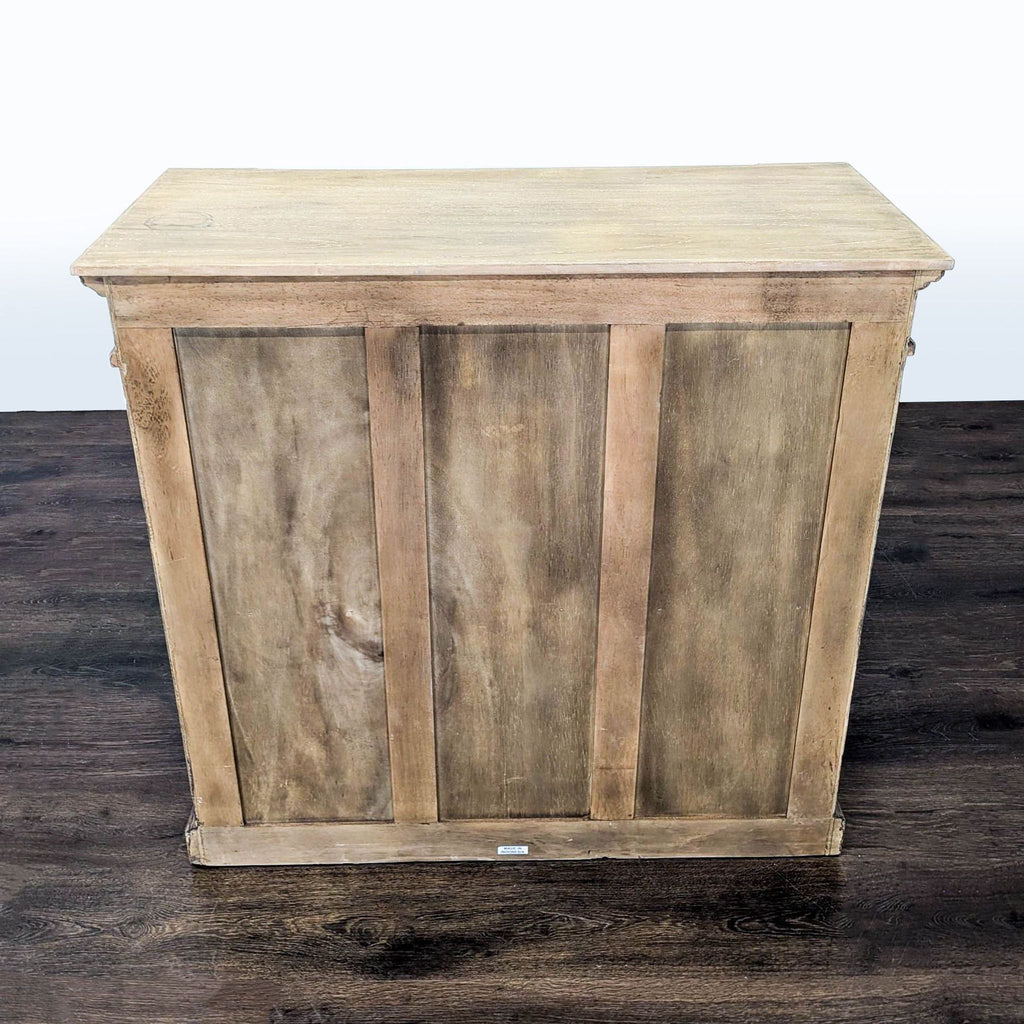 Two Door Cabinet with Molded Designs on Doors