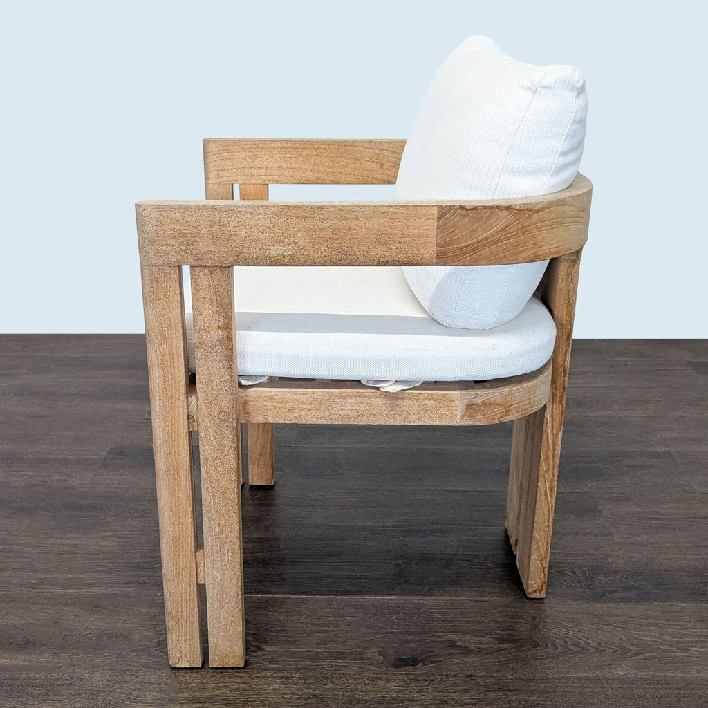 Restoration Hardware teak chair with plush white cushions, suitable for dining or accent seating.