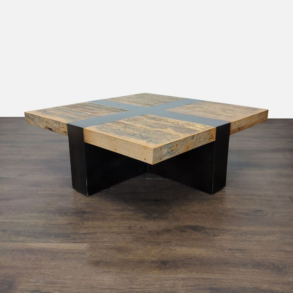 Rustic coffee table with plank wood top and contrasting smooth black band along the edge.