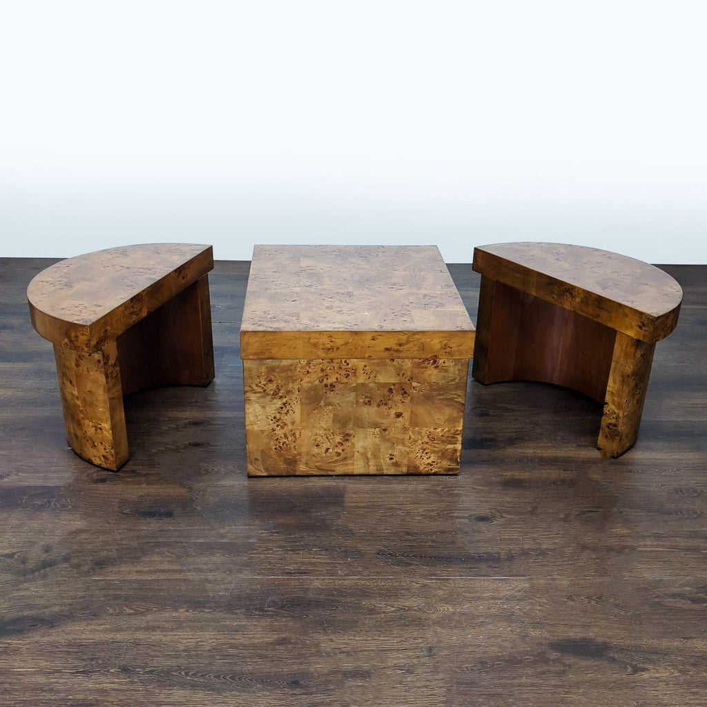 Oval burl wood coffee table by Frontgate includes two half-moon stools that store neatly inside the base.