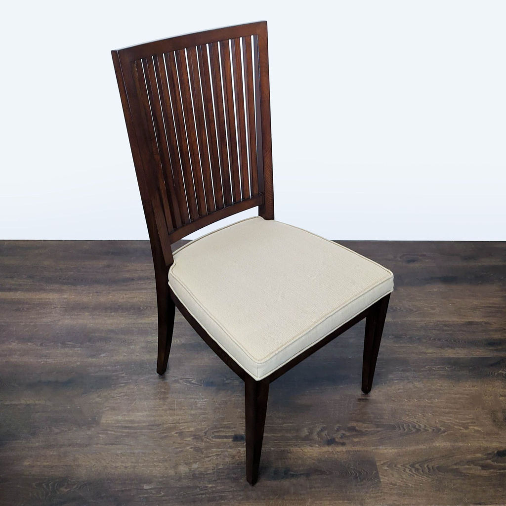 Elegant dark wood dining set with round extendable table and six matching cushioned slat-back chairs.