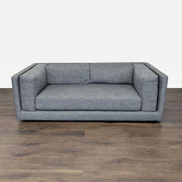 CB2 3-seat sofa in grey fabric with modern boxy design, clean lines, and supportive seat and back.