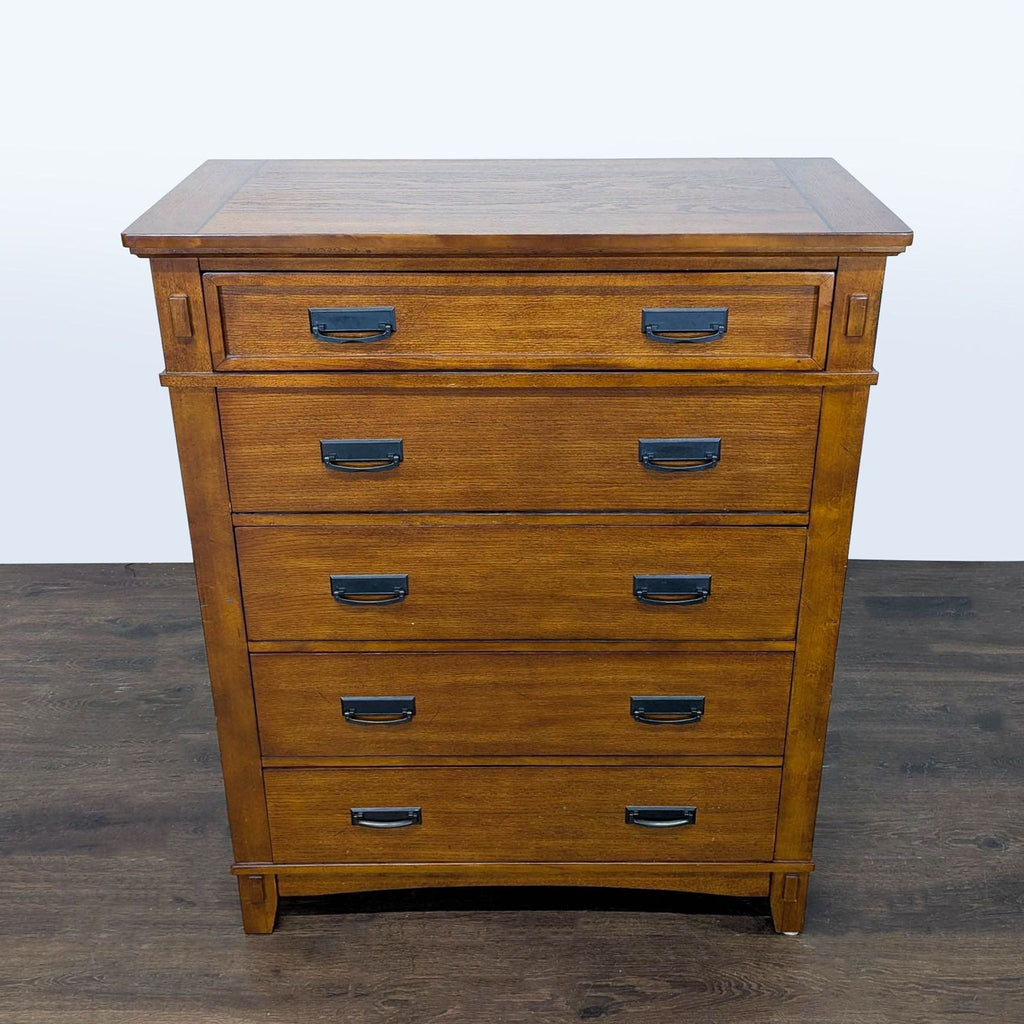 3. Ashley Furniture wooden dresser, five spacious drawers with black handles, classic style for organizing essentials.