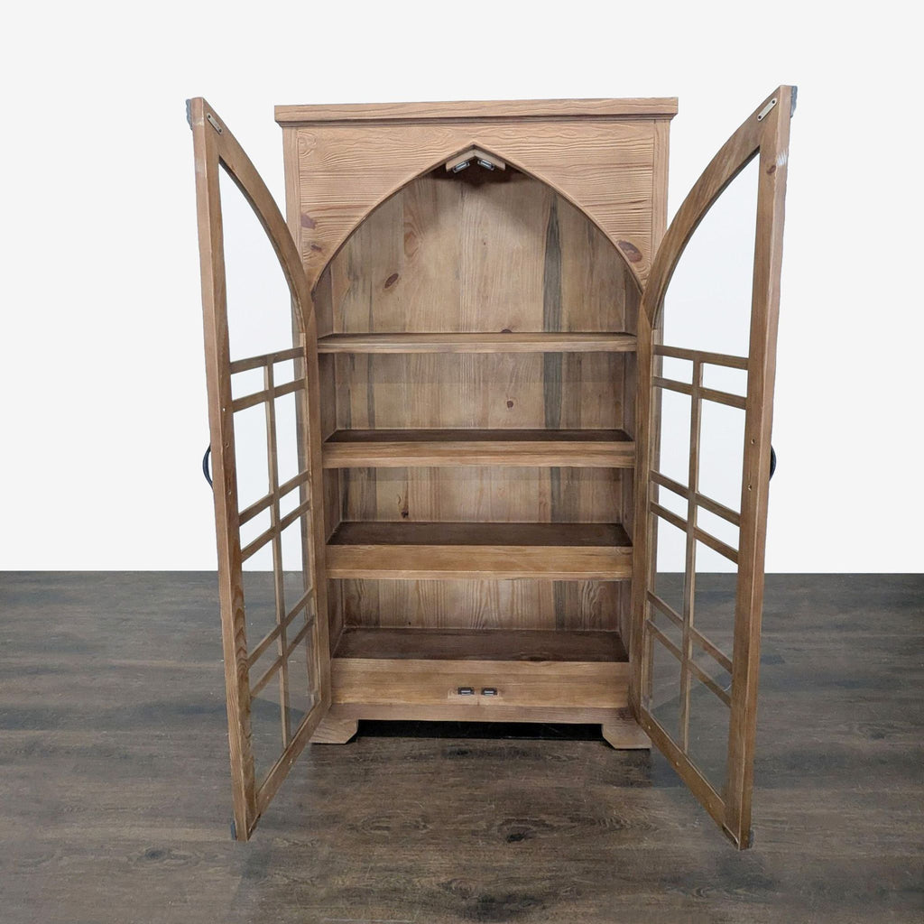 Grandin Road cabinet featuring cathedral window-inspired design, tempered glass doors, and mixed wood-metal accents.  