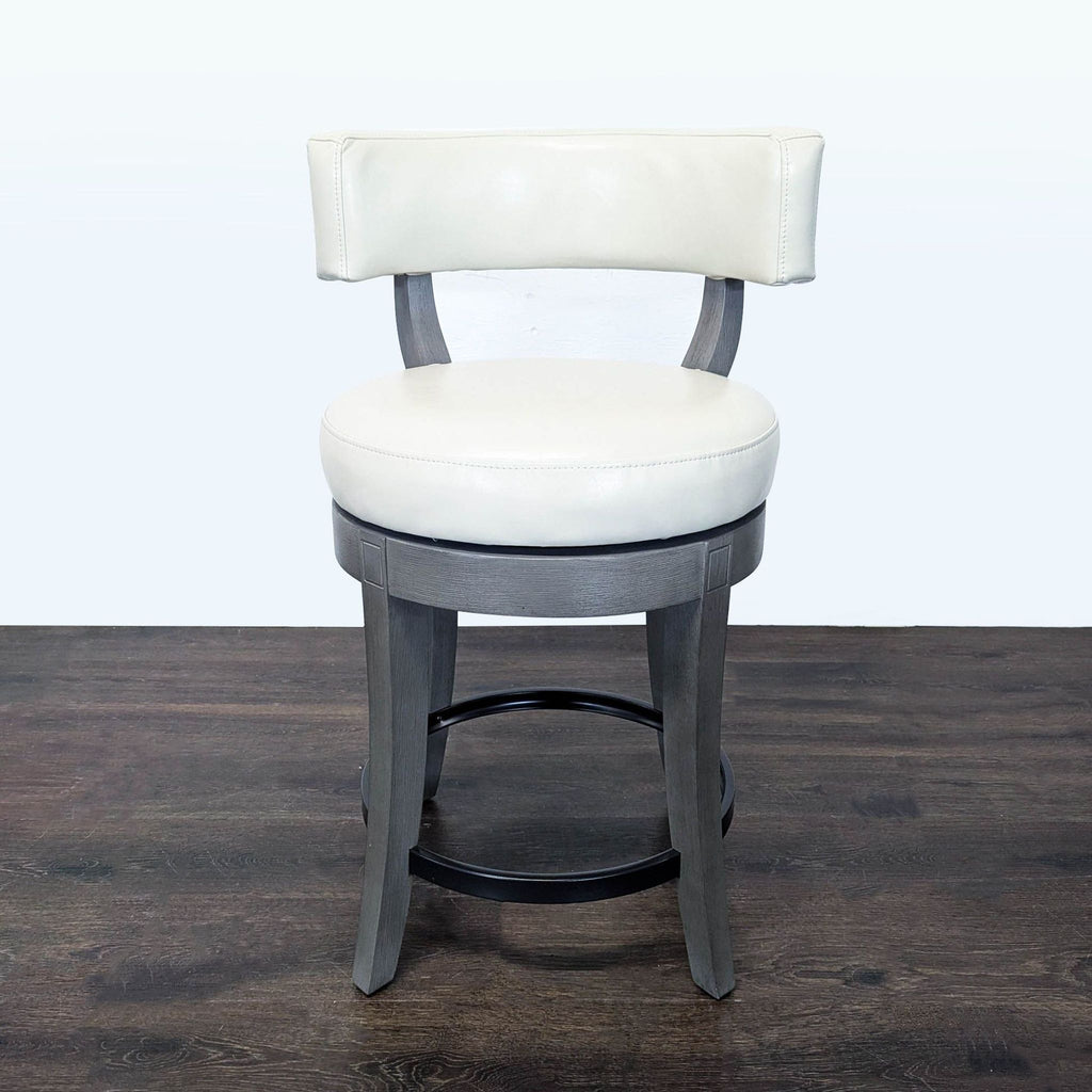 Solid wood stool with bonded leather seat, supportive low back, and carved, flared legs by Grandin Road.  