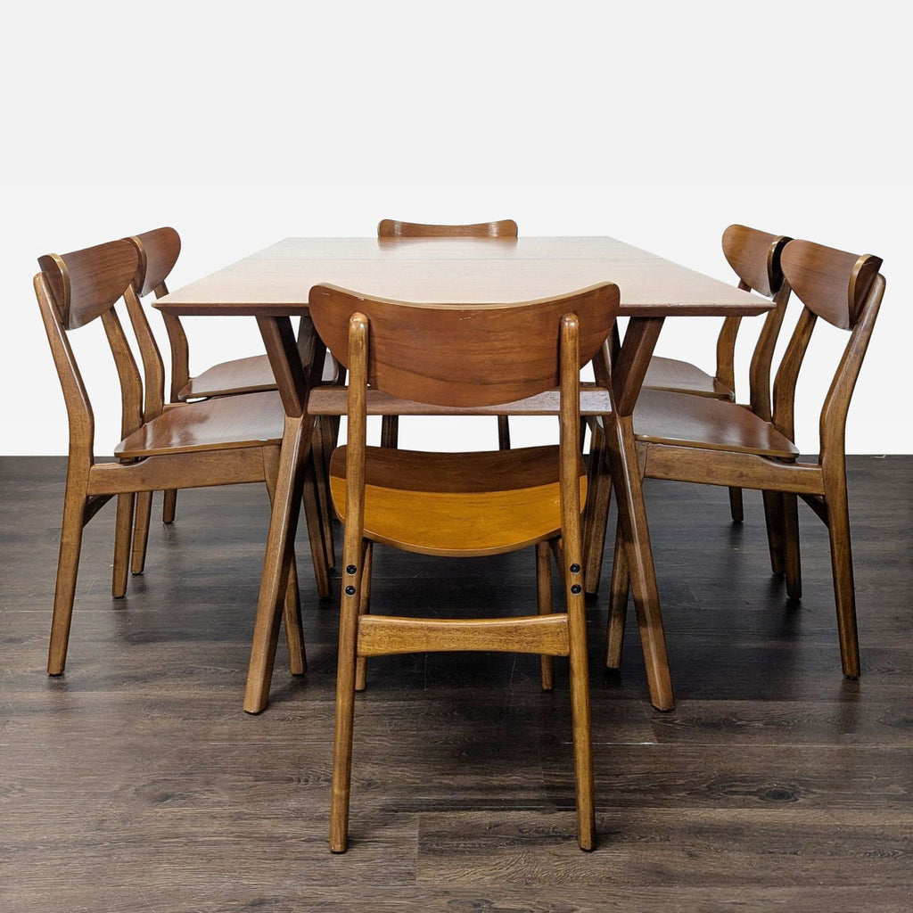 West Elm dining set with an extendable wood table and six mid-century Café chairs, warm finish.