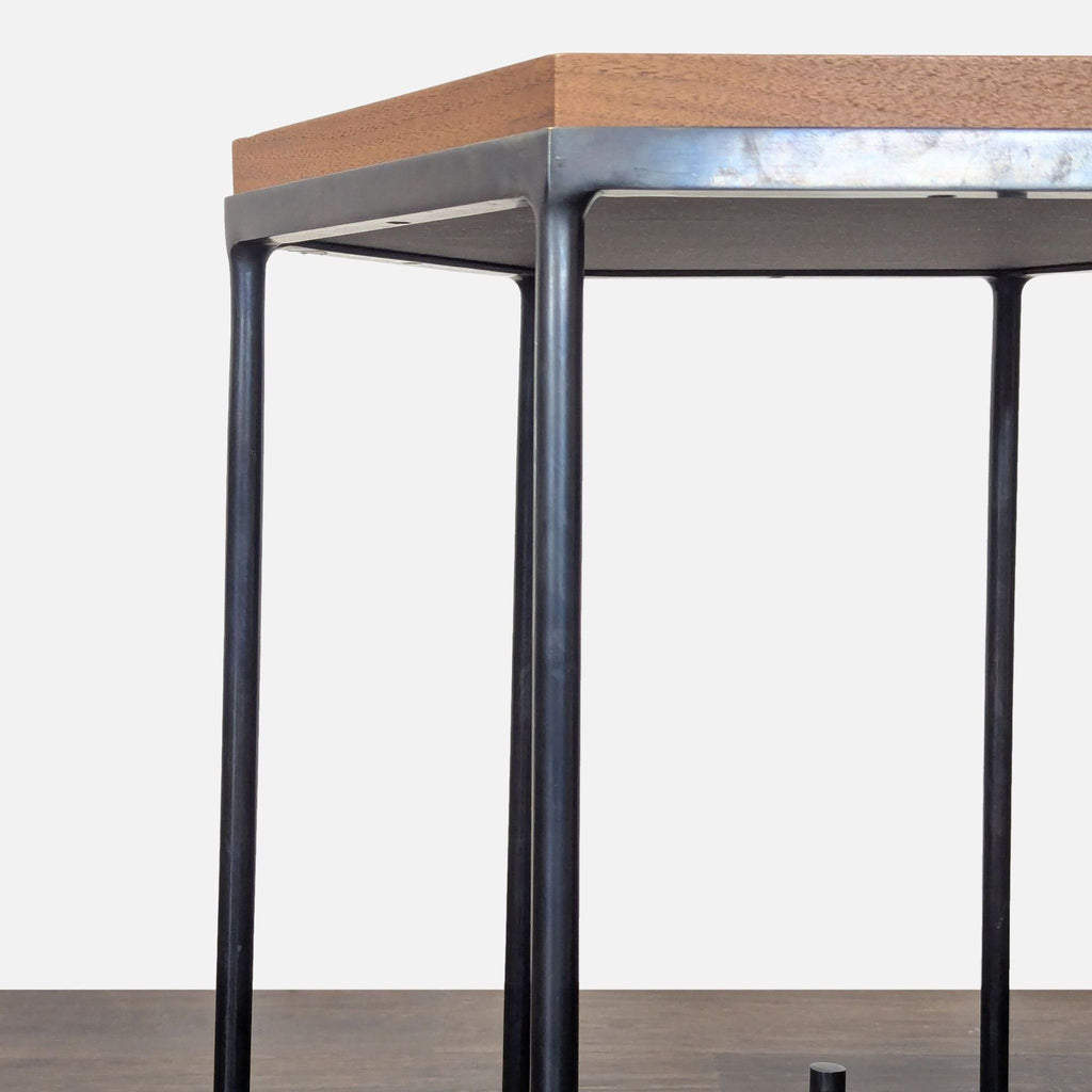 3. Detail of a console table’s sturdy metal frame and thick wooden top, highlighting craftsmanship.